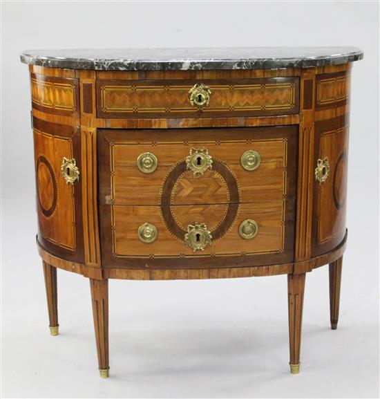 A Louis XVI kingwood, tulipwood, amaranth, sycamore and parquetry demi-lune commode, W.3ft 1.5in.